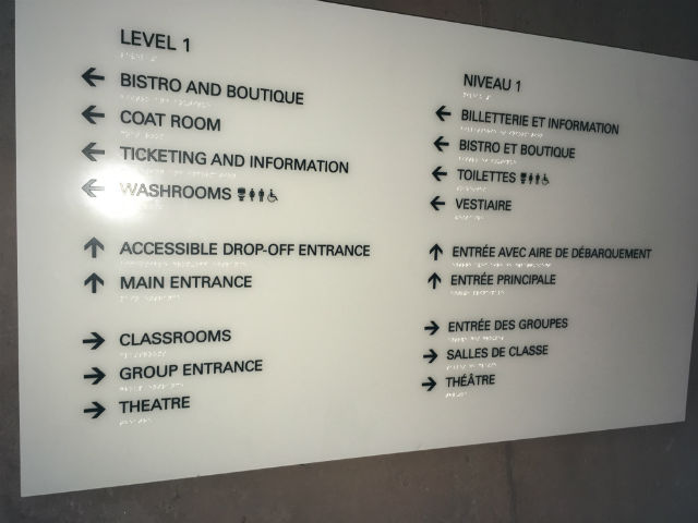 interior sign with braille and directions